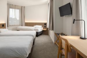 Hotel Chamade客房内的一张或多张床位