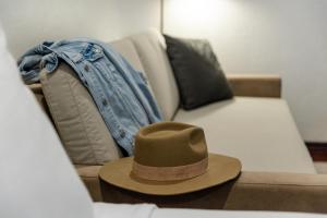 a hat sitting on top of a couch at The Lodge at Jackson Hole in Jackson