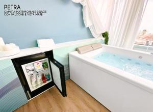 Postel nebo postele na pokoji v ubytování Amamare Luxury Room
