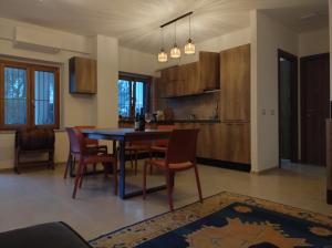 a kitchen and dining room with a table and chairs at Soverato con Vista in Soverato Marina