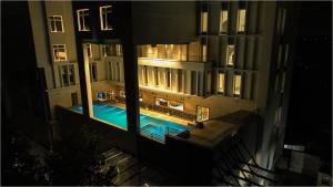 an overhead view of a swimming pool at night at The Grand Sona in Deoghar