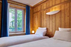 Postel nebo postele na pokoji v ubytování Hôtel de l'Europe by HappyCulture