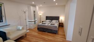 Ένα ή περισσότερα κρεβάτια σε δωμάτιο στο Bungalow an der Tanne mit überdachter Terrasse