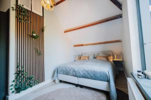 Postel nebo postele na pokoji v ubytování Jacques van Marken Erfgoed