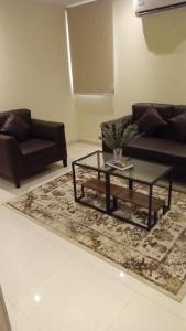 Posezení v ubytování Al tawfeeg hotel - Al Azizyah
