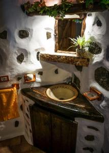 a bathroom with a sink and a mirror at CHC - Casa Rural del Ciruelo in Buenavista del Norte