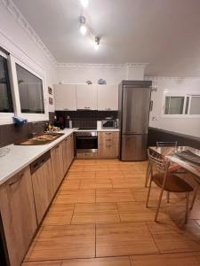 A kitchen or kitchenette at KONTIS' Luxury Detached house near the sea
