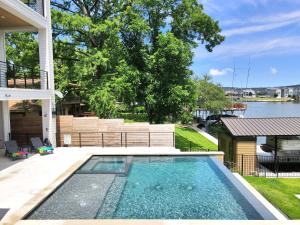 a swimming pool in the backyard of a house at The High Life with Concierge Services in Kingsland