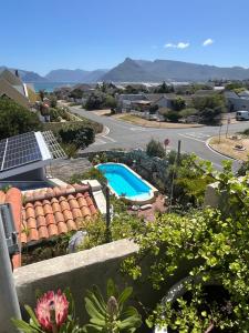 a view from the balcony of a house with a swimming pool at Storyhouse in Kommetjie in Kommetjie