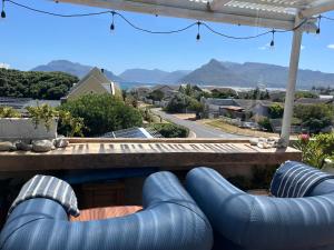 a row of blue pipes on a house with a view at Storyhouse in Kommetjie in Kommetjie