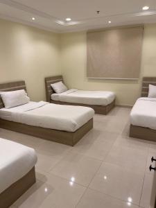Postel nebo postele na pokoji v ubytování Al tawfeeg hotel - Al Azizyah