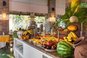 a bunch of fruits and vegetables on a counter at CC Beach Front Papagayo All Inclusive in Culebra