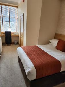 Postel nebo postele na pokoji v ubytování Victoria Hotel