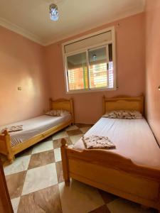 Postel nebo postele na pokoji v ubytování Appartement Mus saidia 1