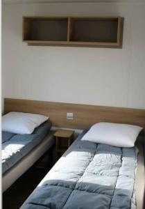 Postel nebo postele na pokoji v ubytování Mobil home contis