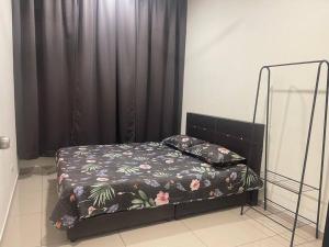 a bed in a room with a black curtain at Felina Homestay Condo Selayang Batu Caves MusIim Friendly in Kuala Lumpur +10 photos
