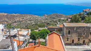 an aerial view of a town with the ocean in the background at RODIBLUE VILLAGE Apartments in Rodia