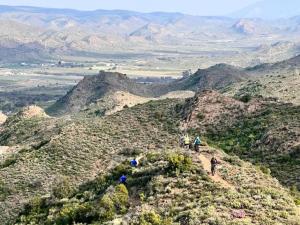 a group of people walking on top of a mountain at Aardvark Bioreserve in Ladismith