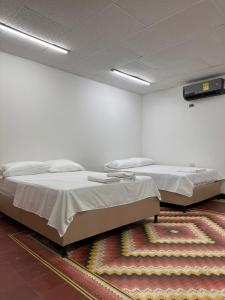 Postel nebo postele na pokoji v ubytování HOSTAL CASA PALMA + 10 fotografií