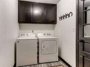 a kitchen with a stove and a refrigerator at Country home near Norman on 5 ac in Newcastle +10 photos