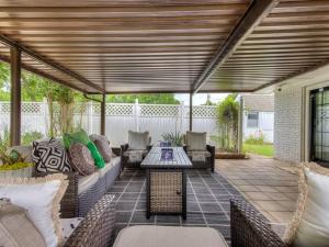 a patio with a couch and chairs and a table at Country home near Norman on 5 ac in Newcastle