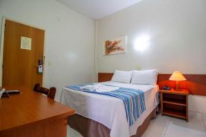 Postel nebo postele na pokoji v ubytování Hotel Dan Inn Barretos by Nacional Inn