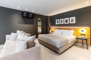 Posteľ alebo postele v izbe v ubytovaní Porta Suites