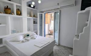 Postel nebo postele na pokoji v ubytování Anoi Rooms