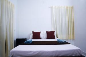 Guestland Homestay客房内的一张或多张床位