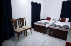 Guestland Homestay客房内的一张或多张床位