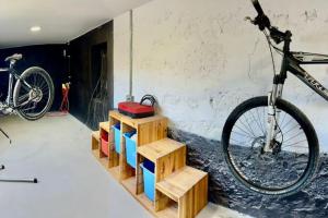 a bike parked in a room with wooden crates at El Granero in Moya