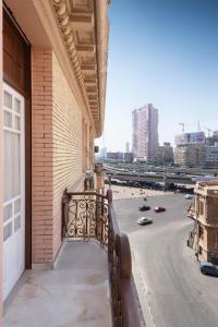 a balcony of a building with a view of a street at Museum Studios in Cairo
