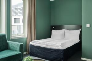 Postel nebo postele na pokoji v ubytování Smarthotel Oslo