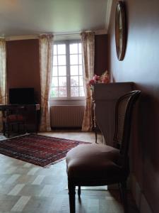 Posezení v ubytování Gîte à la Moncorgerie + 9 fotografií