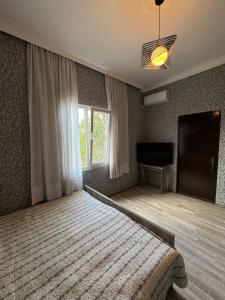 Postel nebo postele na pokoji v ubytování Nugo Villa
