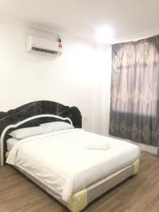 Postel nebo postele na pokoji v ubytování GLhotel kudat