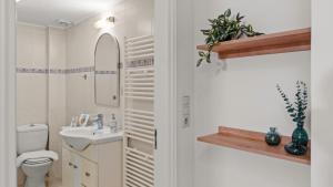 a bathroom with a toilet and a sink at Heraklion Crete Monis Prevelis 74 3BRS 2BTHS Fast WiFi in Bendevís +46 photos