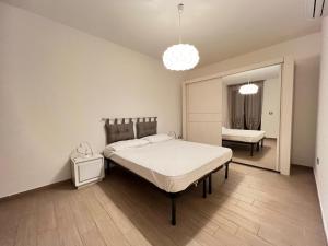 Postel nebo postele na pokoji v ubytování Ema Home