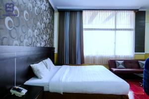 Bandung Permai Hotel Jember客房内的一张或多张床位