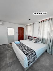 A bed or beds in a room at White Fortress