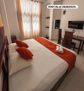 A bed or beds in a room at White Fortress