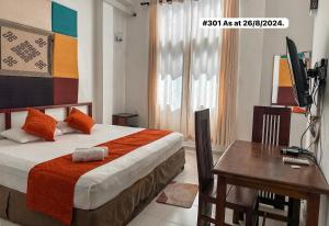A bed or beds in a room at White Fortress