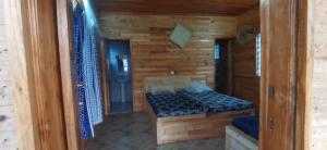Postel nebo postele na pokoji v ubytování DHATITO BEACH - Sè