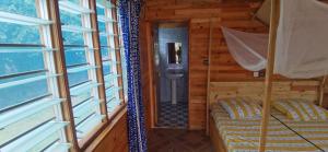 Postel nebo postele na pokoji v ubytování DHATITO BEACH - Sè
