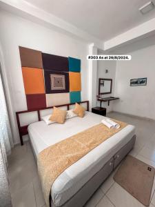 A bed or beds in a room at White Fortress