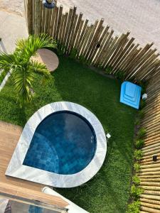 an overhead view of a swimming pool in a yard at Villa Maia Beach - Duplex in São Miguel dos Milagres