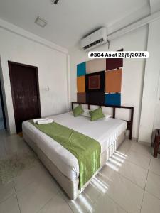 A bed or beds in a room at White Fortress