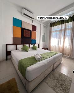 A bed or beds in a room at White Fortress