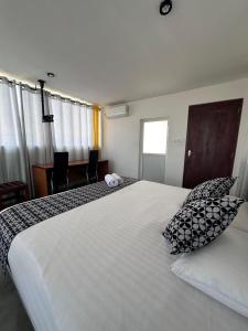 A bed or beds in a room at White Fortress