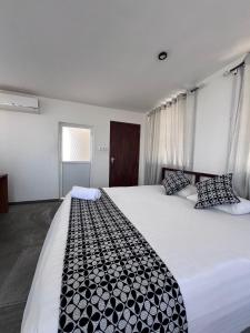 A bed or beds in a room at White Fortress